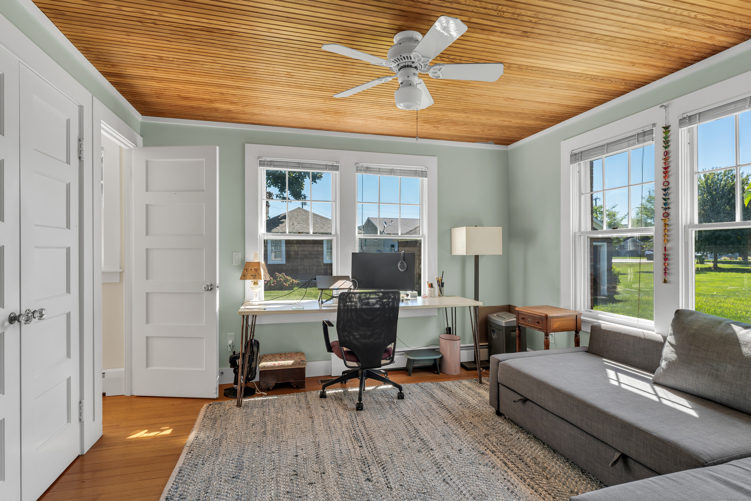 27 Ridgewood Avenue Madison, CT 06443 - Photo 5 of 31 a living room with furniture and a wooden floor