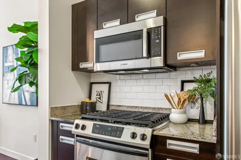 a kitchen with a stove and a microwave