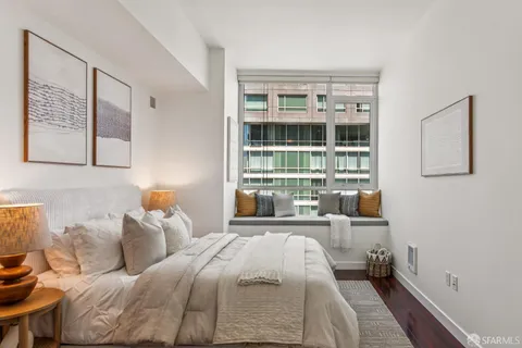 a bed room with a bed and a window