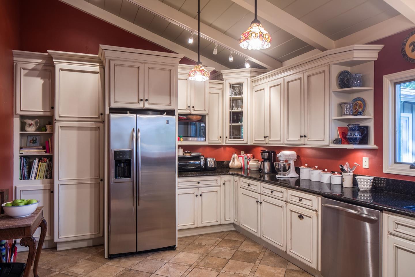 4117 Sunridge Road Pebble Beach, CA 93953 - Photo 11 of 30 a kitchen with stainless steel appliances granite countertop a refrigerator and a sink