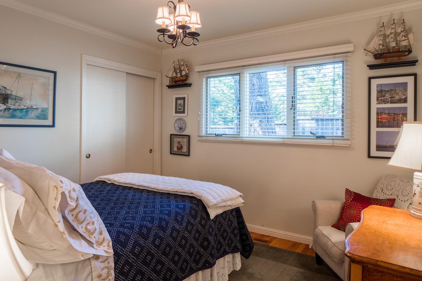 4117 Sunridge Road Pebble Beach, CA 93953 - Photo 12 of 30 a bedroom with a bed dresser and a window