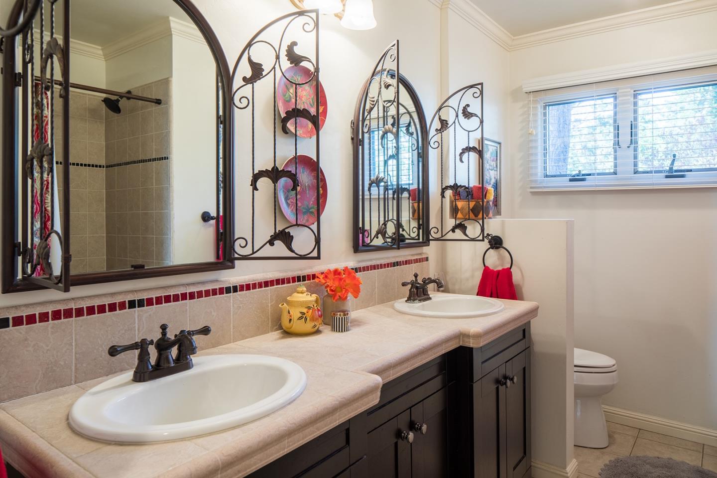 4117 Sunridge Road Pebble Beach, CA 93953 - Photo 13 of 30 a bathroom with a sink and a mirror