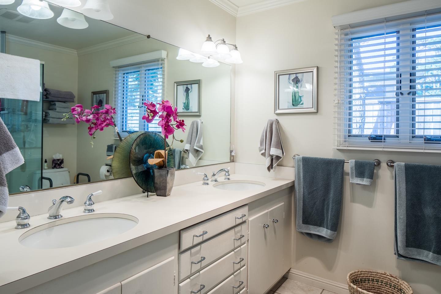 4117 Sunridge Road Pebble Beach, CA 93953 - Photo 15 of 30 a bathroom with a sink double vanity and a mirror