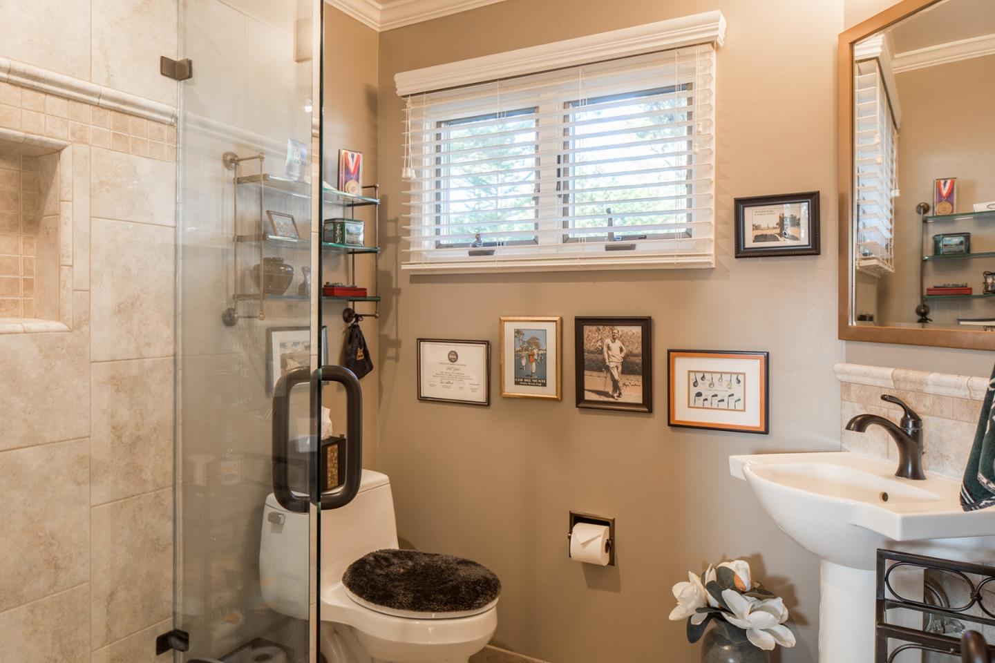 4117 Sunridge Road Pebble Beach, CA 93953 - Photo 18 of 30 a bathroom with a sink and a mirror
