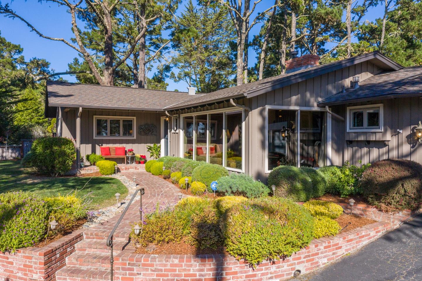 4117 Sunridge Road Pebble Beach, CA 93953 - Photo 2 of 30 a front view of house with yard and green space