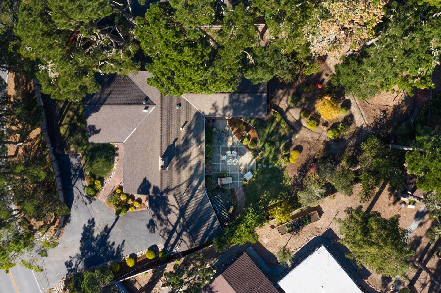 4117 Sunridge Road Pebble Beach, CA 93953 - Photo 27 of 30 an aerial view of a house with a yard and garden