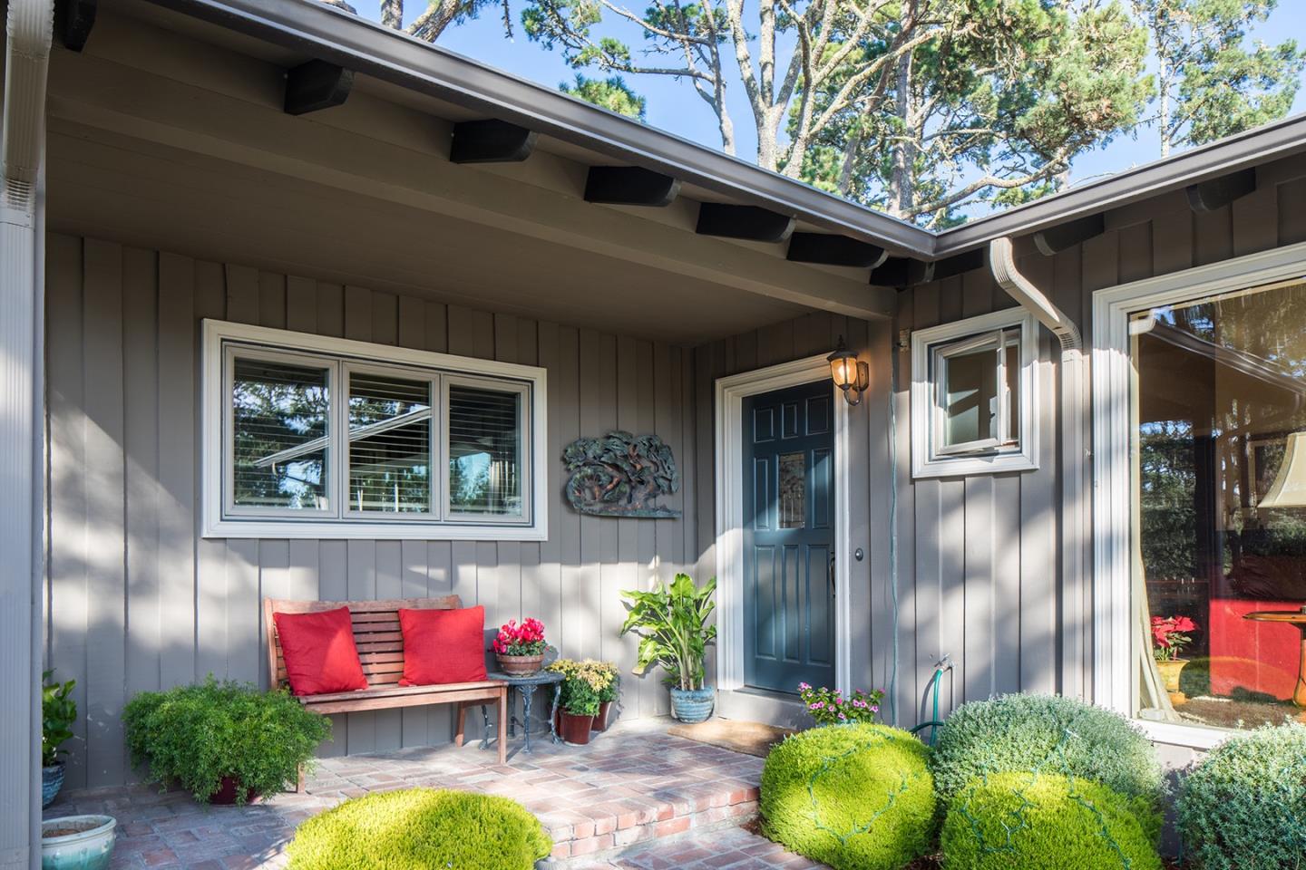 4117 Sunridge Road Pebble Beach, CA 93953 - Photo 3 of 30 a backyard of a house with seating space