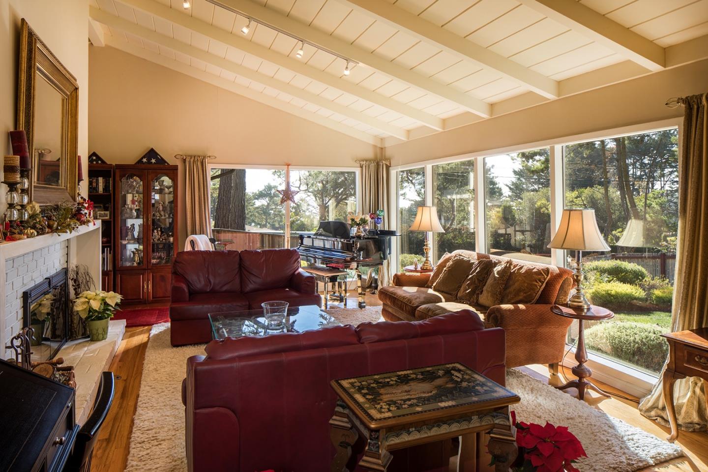 4117 Sunridge Road Pebble Beach, CA 93953 - Photo 5 of 30 a living room with lots of furniture and a floor to ceiling window