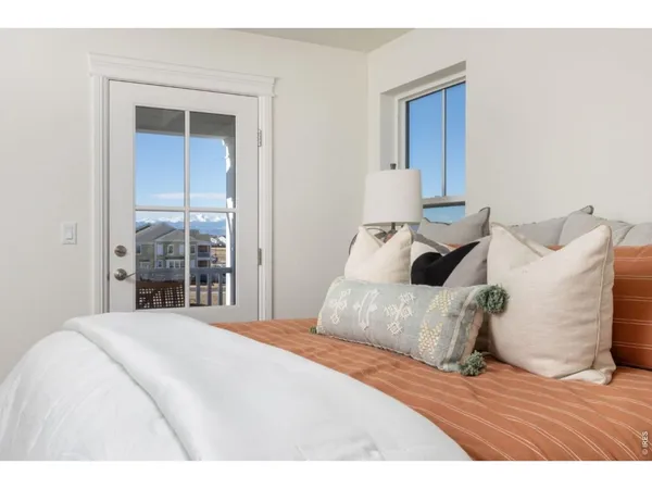 a bed room with a bed and a night stand