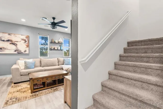 a living room with furniture and a painting