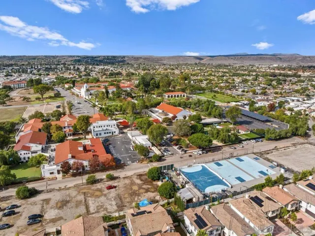an aerial view of residential houses with outdoor space