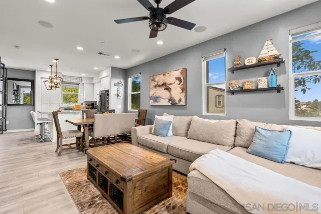 a living room with furniture and a rug