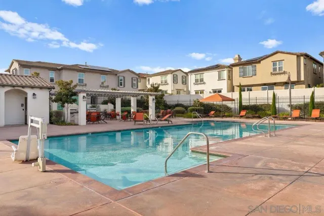 a front view of a building with trees