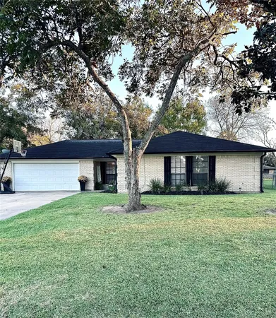 a house that has a tree in front of the house