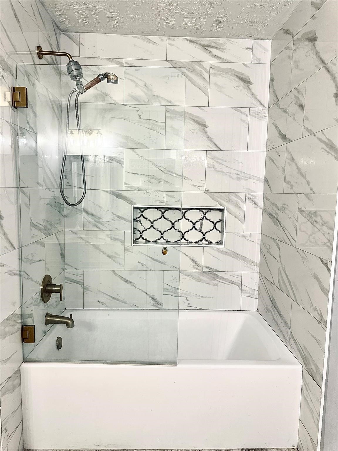 1457 Camellia Street Sweeny, TX 77480 - Photo 15 of 29 a bathroom with a bathtub and shower