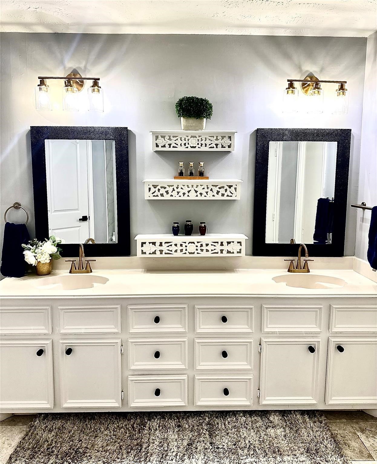 1457 Camellia Street Sweeny, TX 77480 - Photo 16 of 29 a bathroom with a sink vanity and mirror