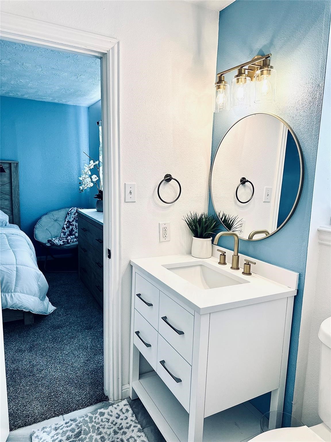 1457 Camellia Street Sweeny, TX 77480 - Photo 20 of 29 a en suite bathroom with a sink and a mirror