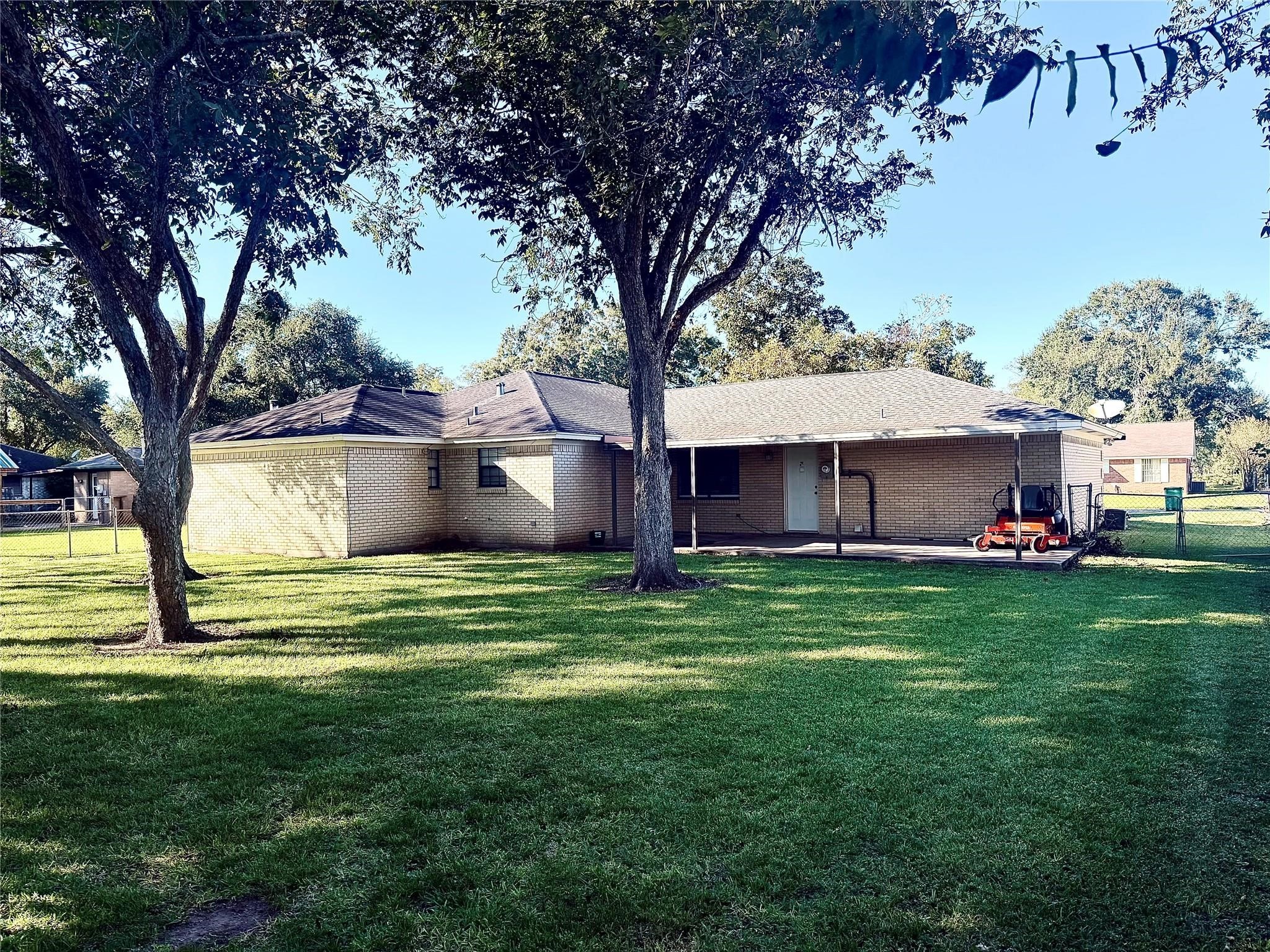 1457 Camellia Street Sweeny, TX 77480 - Photo 28 of 29 a view of a house with a yard