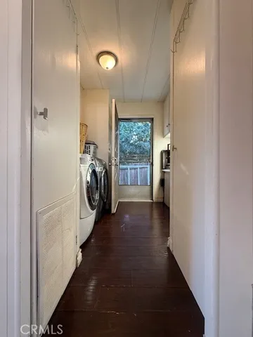 an aerial view of multiple houses with a yard