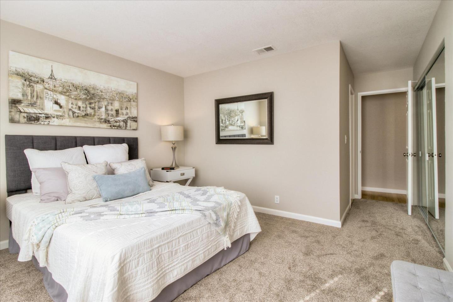 84 Rancho Drive, Unit H San Jose, CA 95111 - Photo 12 of 27 a bedroom with bed and wall painting
