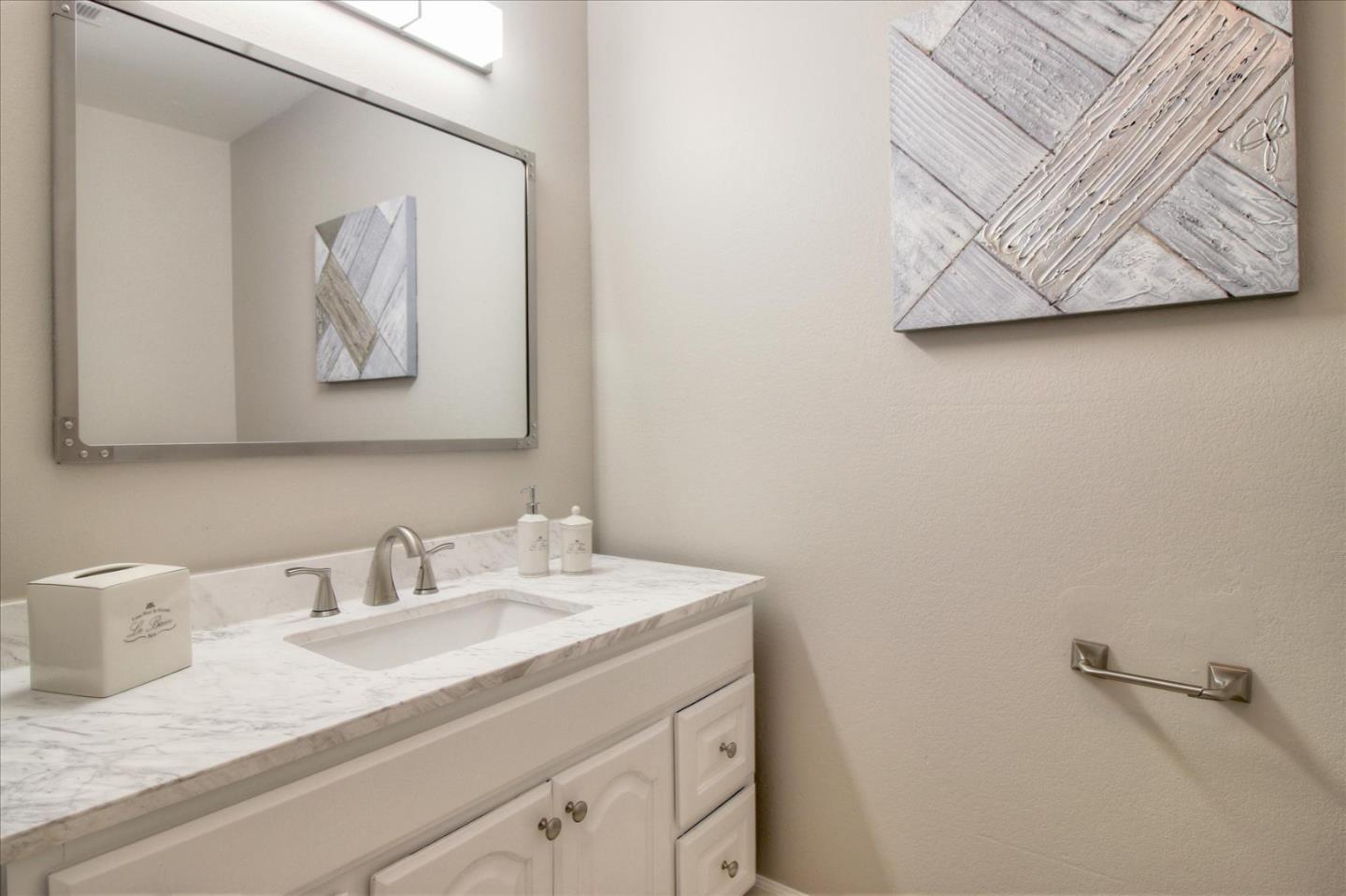 84 Rancho Drive, Unit H San Jose, CA 95111 - Photo 15 of 27 a bathroom with a sink and a mirror