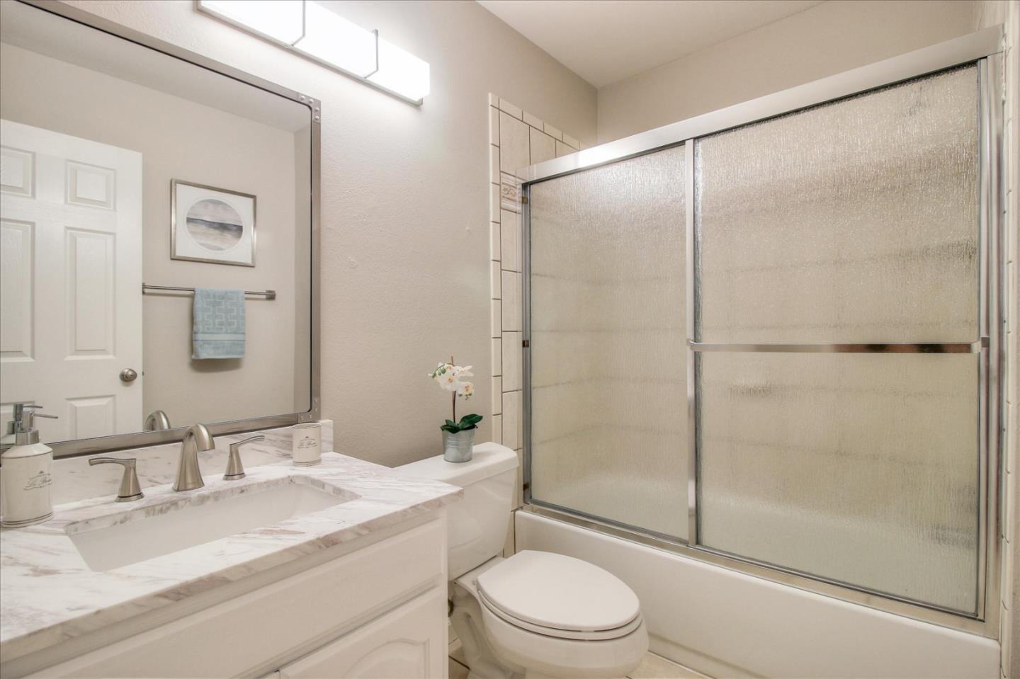 84 Rancho Drive, Unit H San Jose, CA 95111 - Photo 17 of 27 a bathroom with a granite countertop sink toilet and shower
