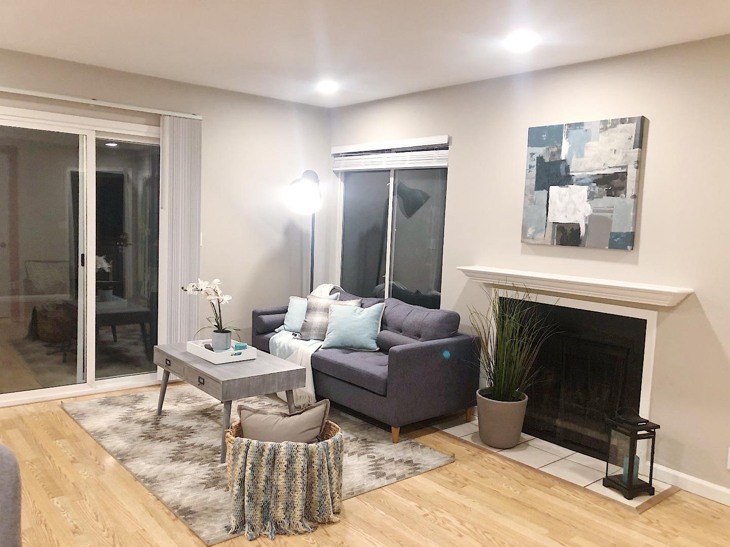 84 Rancho Drive, Unit H San Jose, CA 95111 - Photo 25 of 27 a living room with furniture and a fireplace