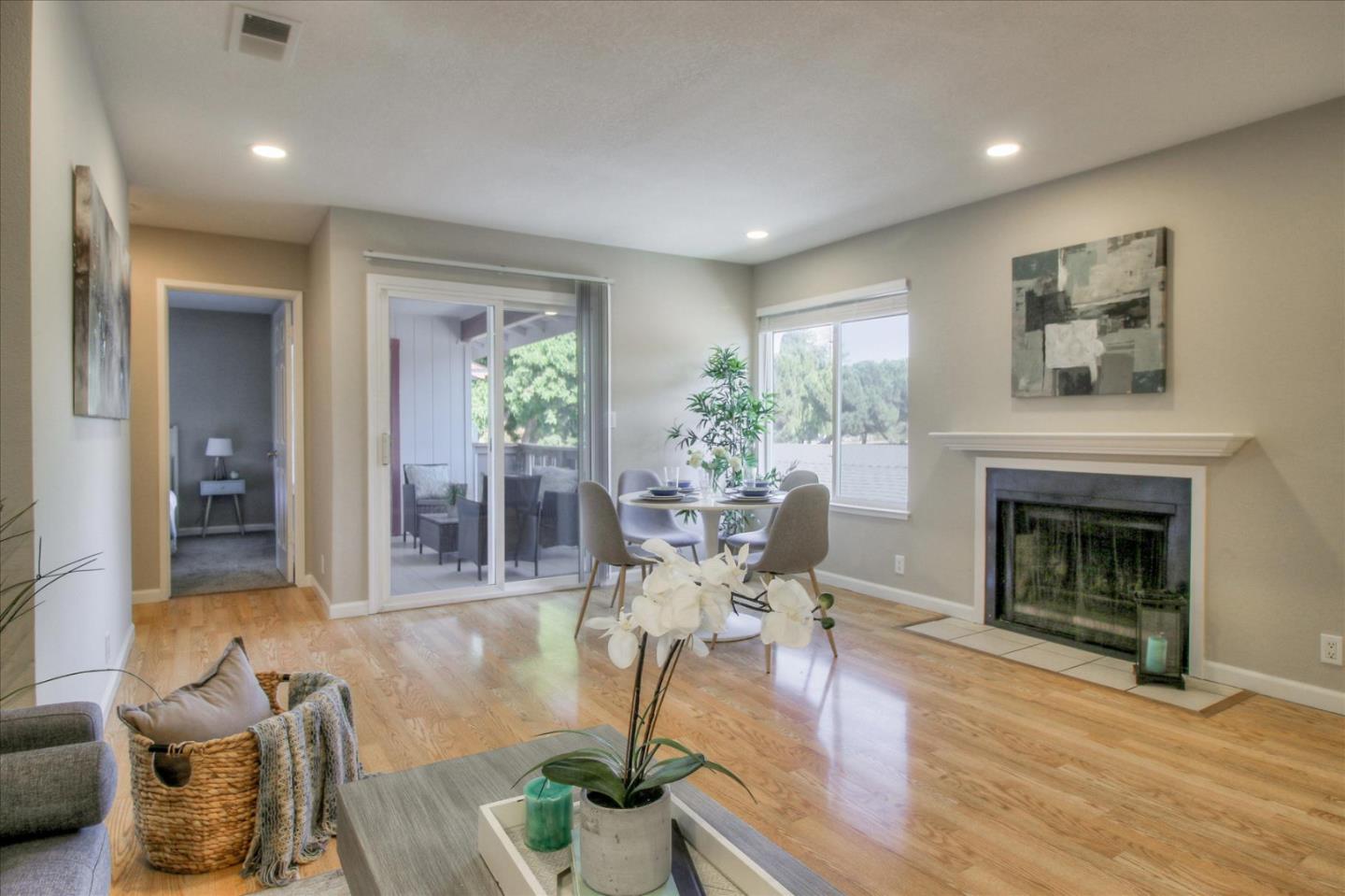 84 Rancho Drive, Unit H San Jose, CA 95111 - Photo 3 of 27 a living room with furniture and a fireplace