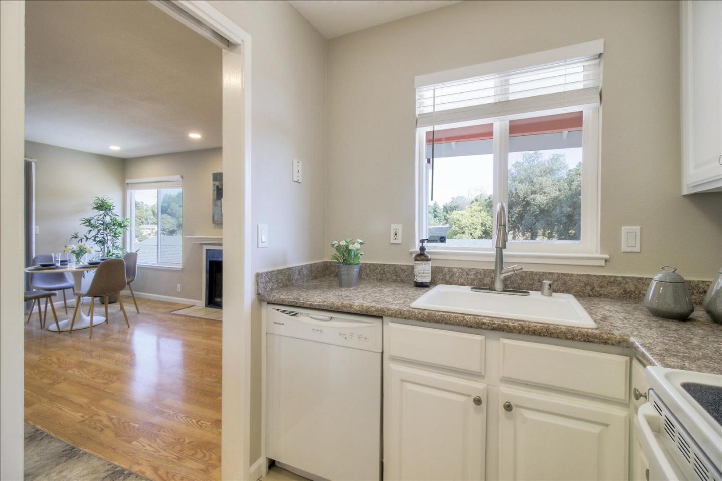 84 Rancho Drive, Unit H San Jose, CA 95111 - Photo 6 of 27 a bathroom with a granite countertop sink and a window
