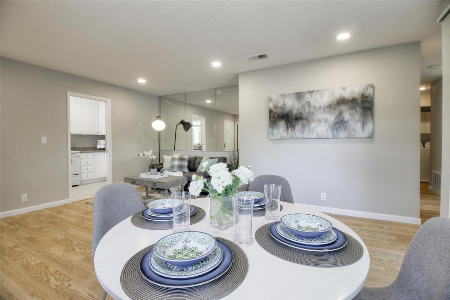 84 Rancho Drive, Unit H San Jose, CA 95111 - Photo 7 of 27 a dining room with furniture and a table