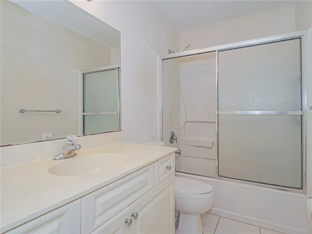 a bathroom with a tub and sink