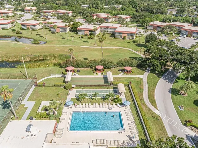 a view of a backyard with swimming pool