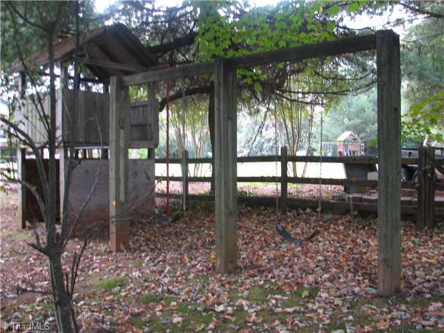 6979 Bridgewood Road Clemmons, NC 27012 - Photo 15 of 15 Exterior Back. Playhouse and swing for the children!