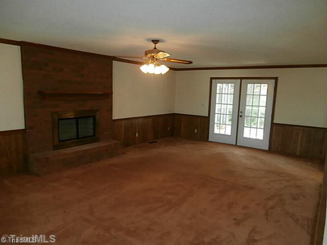 6979 Bridgewood Road Clemmons, NC 27012 - Photo 10 of 15 Den/Family/Great Room. Living Area with Fireplace and French Doors to a screened in Porch!