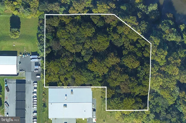 an aerial view of house with yard