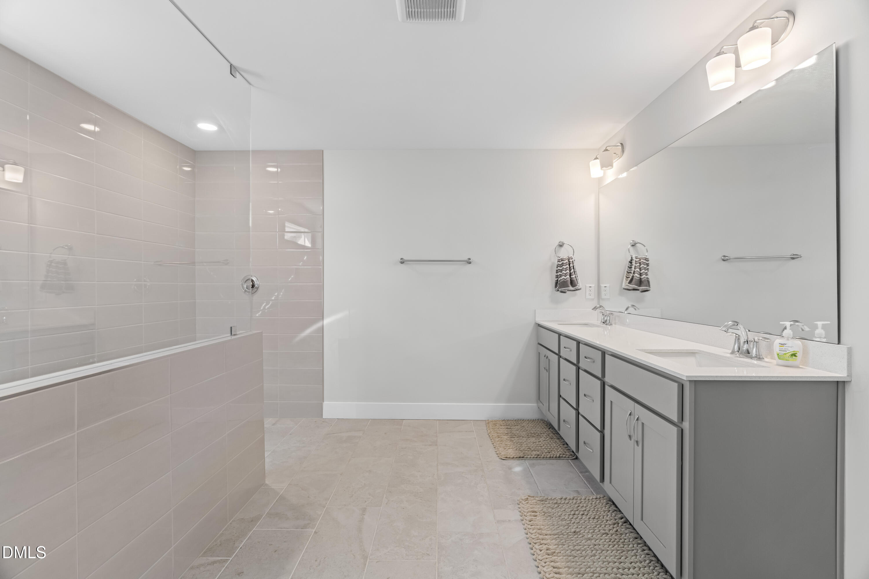 108 Bridge Street Smithfield, NC 27577 - Photo 21 of 48 a bathroom with a double vanity sink and mirror