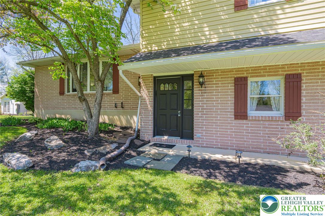 3857 Friedens Road Slatington, PA 18080 - Photo 4 of 75 This inviting home features a classic brick exterior with charming shutter accents.