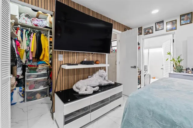 a room with furniture and a flat screen tv