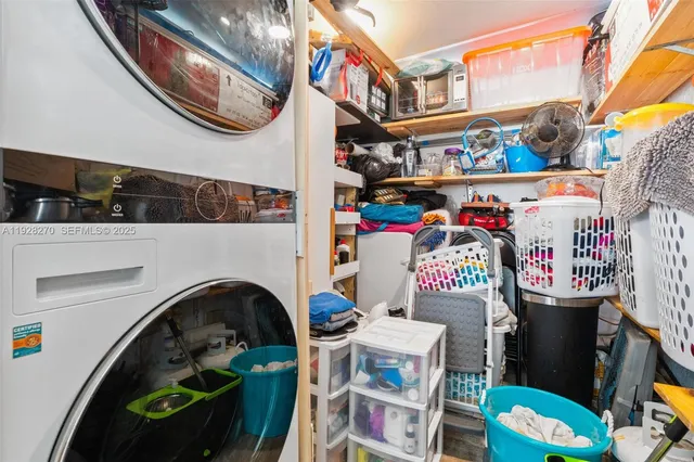 a living room with fireplace furniture and a potted plant