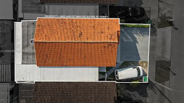 an aerial view of a houses with a city street