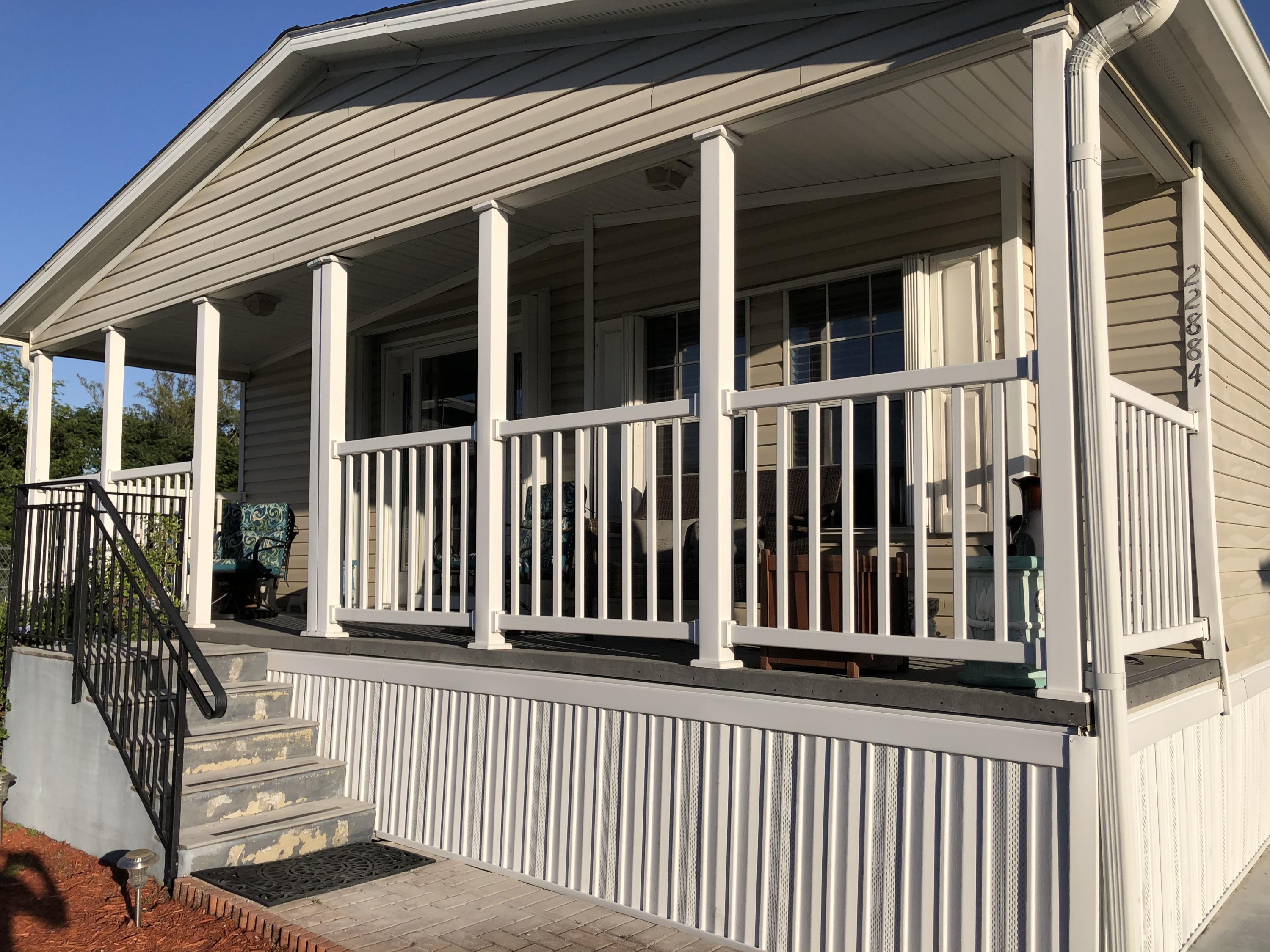 22884 Neptune Road Boca Raton, FL 33428 - Photo 2 of 19 a view of a house with wooden fence
