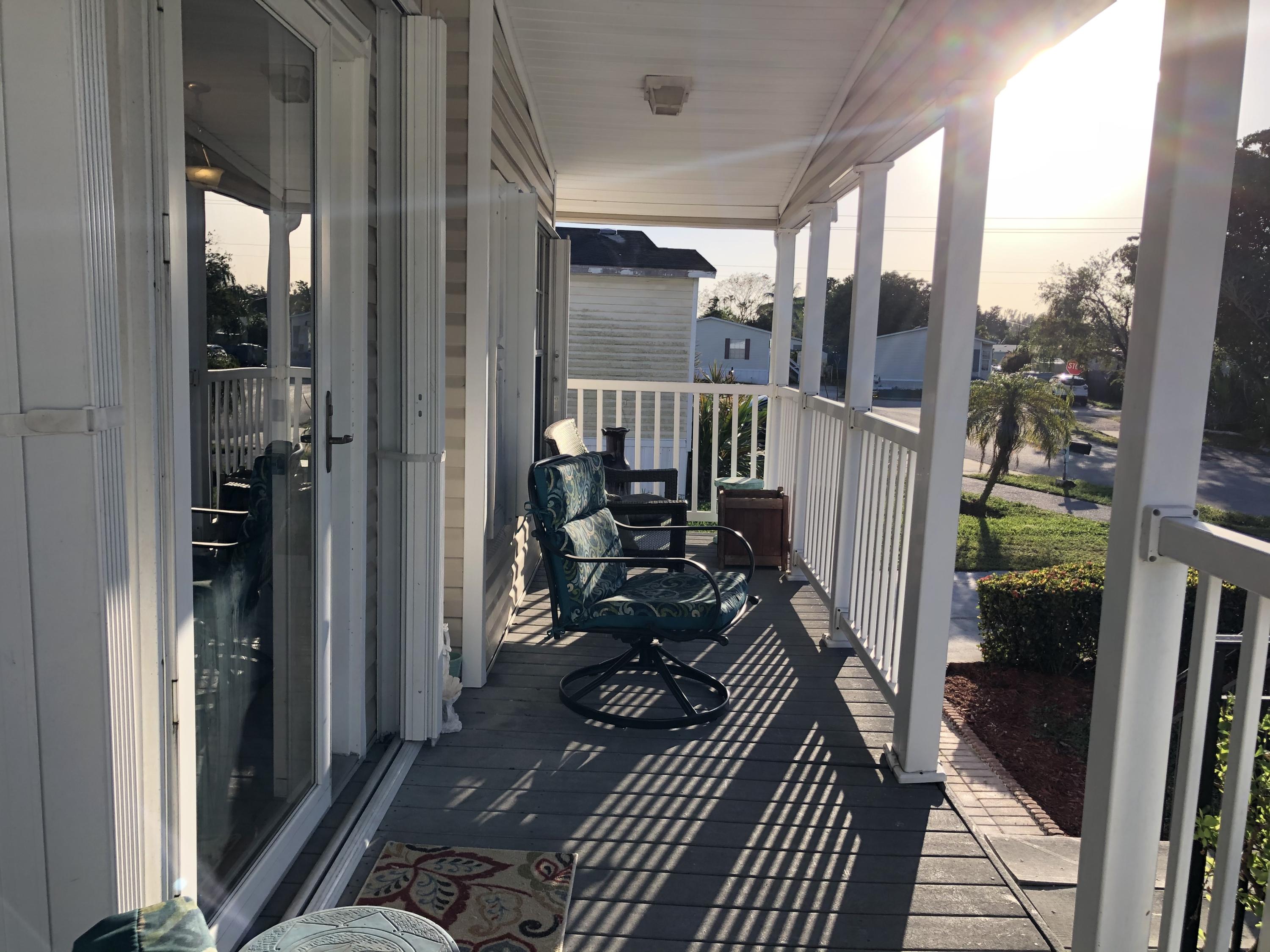 22884 Neptune Road Boca Raton, FL 33428 - Photo 4 of 19 a view of a balcony with couch