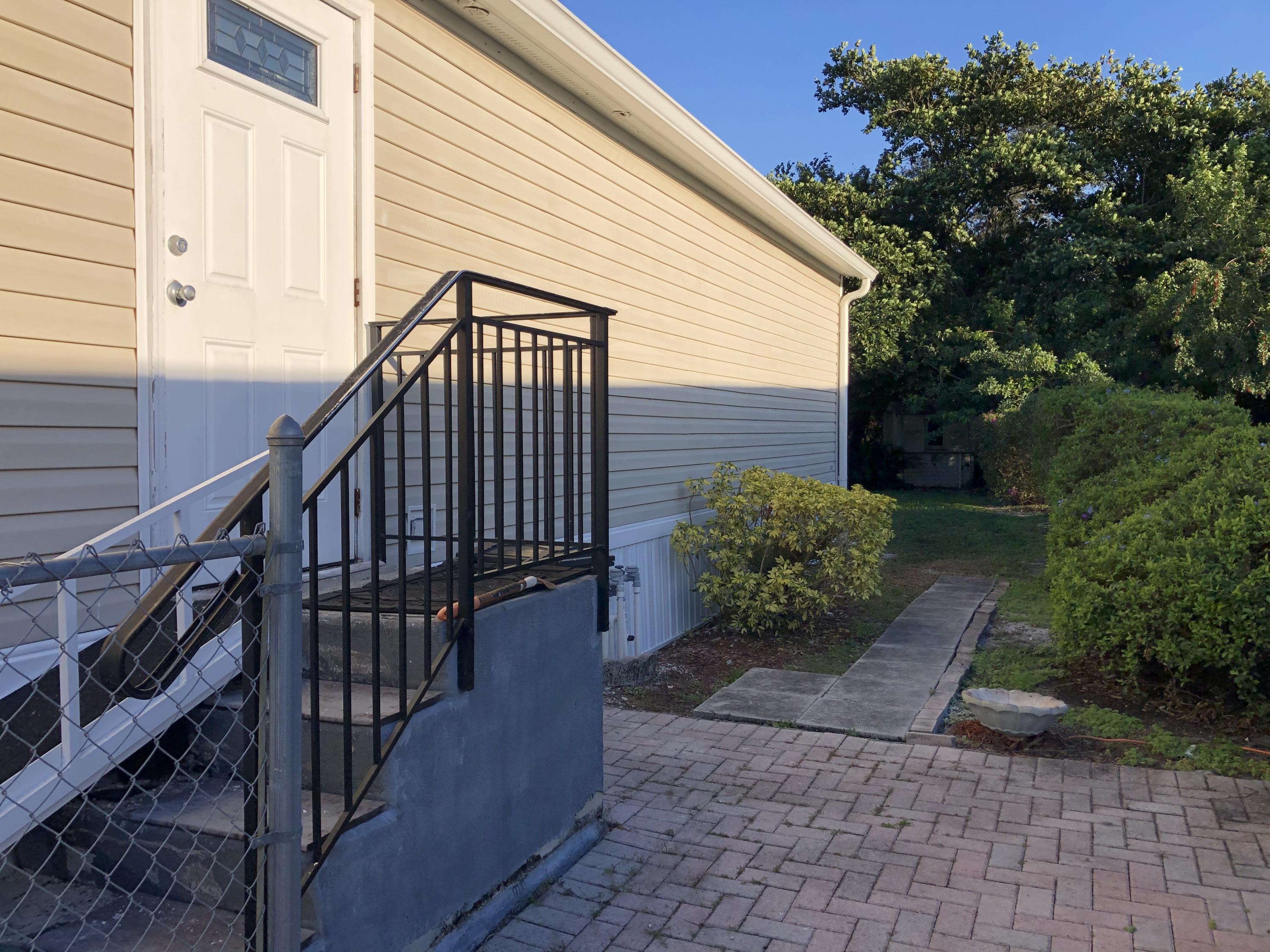 22884 Neptune Road Boca Raton, FL 33428 - Photo 5 of 19 a view of a house with backyard and garden