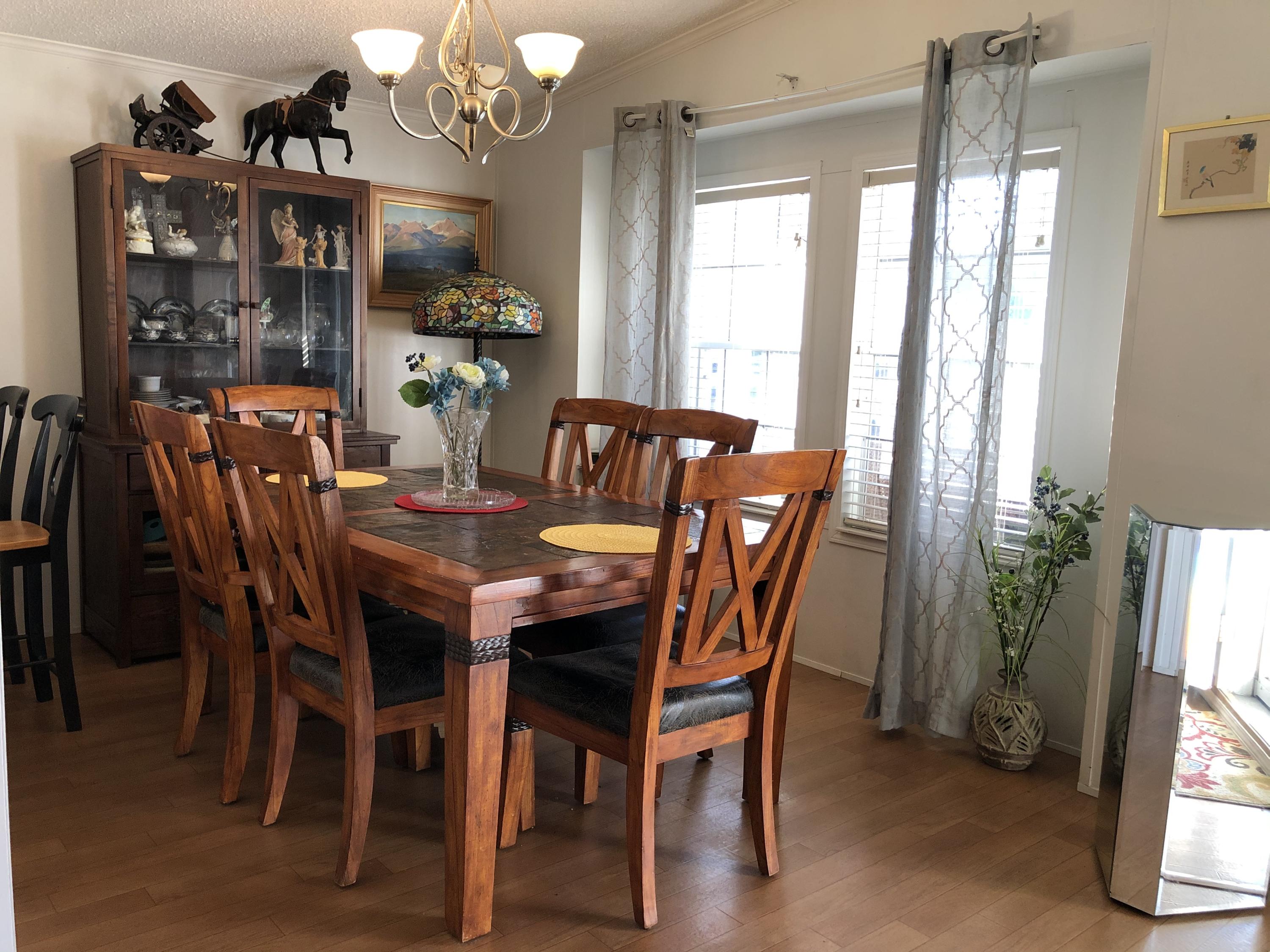 22884 Neptune Road Boca Raton, FL 33428 - Photo 7 of 19 a view of a dining room with furniture and window