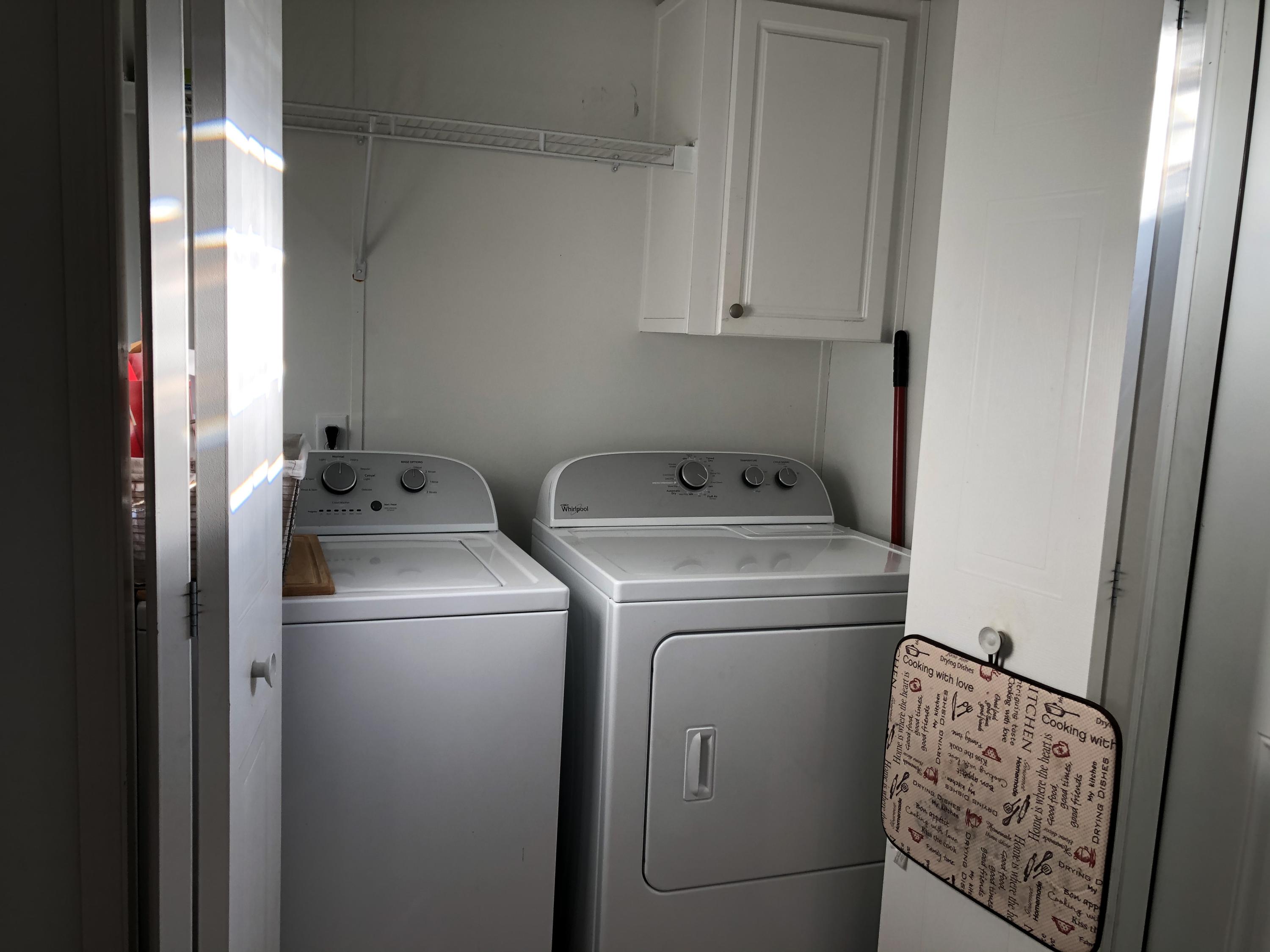 22884 Neptune Road Boca Raton, FL 33428 - Photo 9 of 19 a utility room with dryer and washer