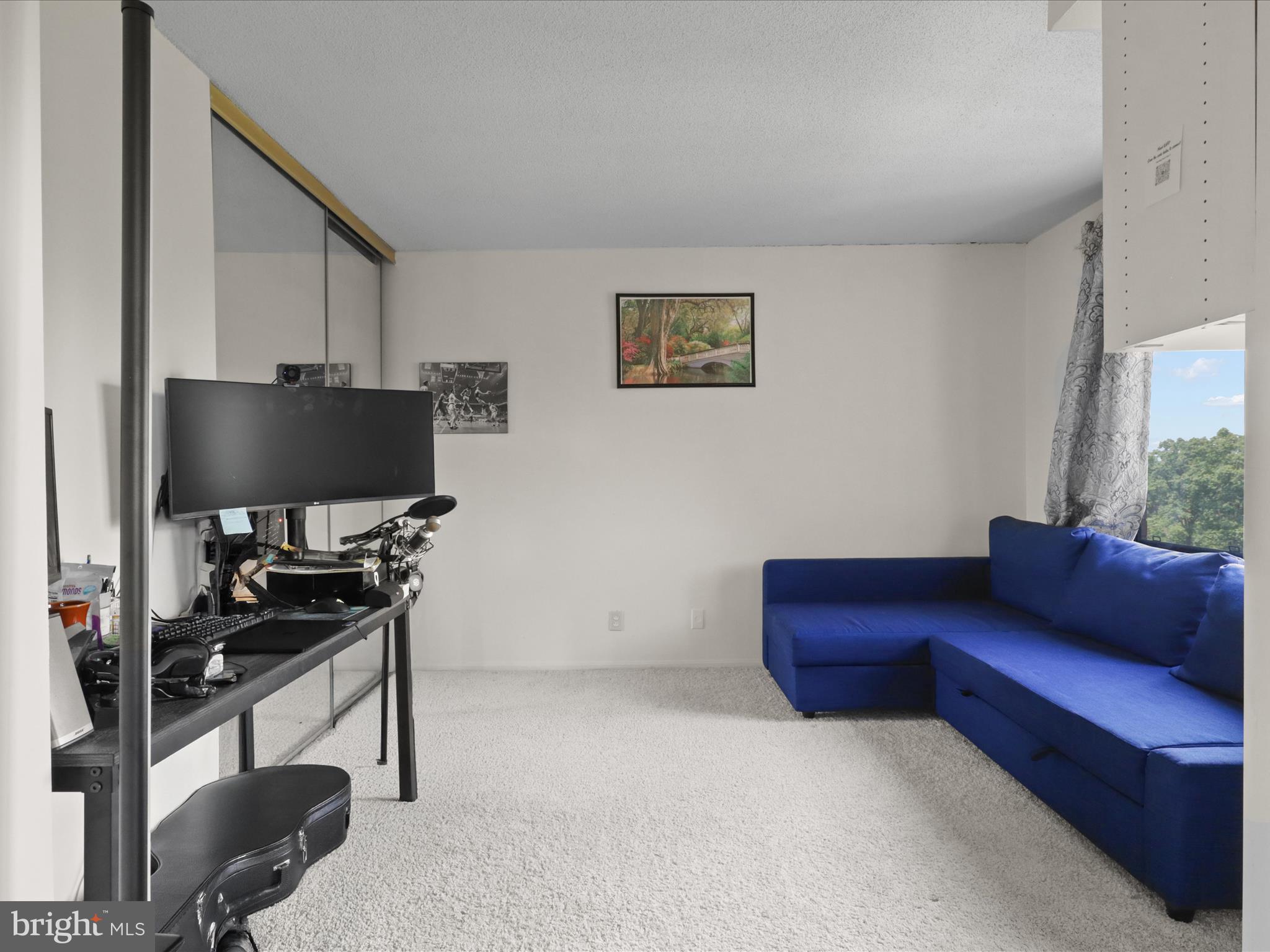 205 Yoakum Parkway, Unit 1020 Alexandria, VA 22304 - Photo 21 of 62 a living room with furniture and a flat screen tv