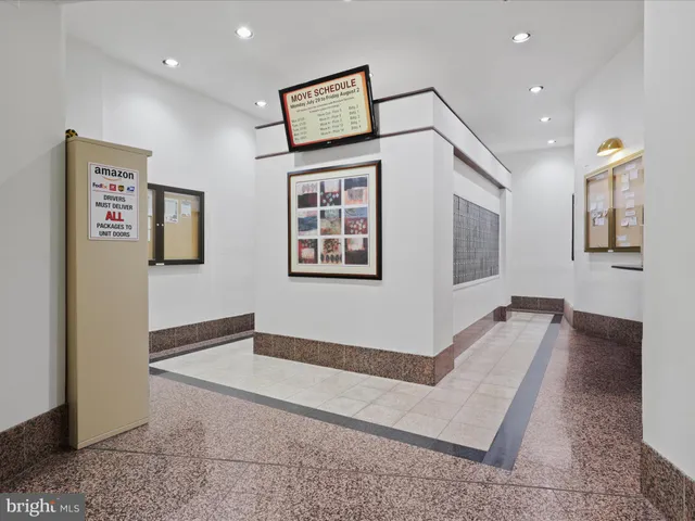 a view of hallway with wooden floor