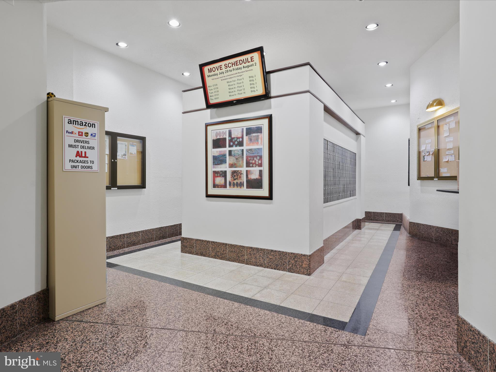 205 Yoakum Parkway, Unit 1020 Alexandria, VA 22304 - Photo 29 of 62 a view of a bedroom with wooden floor and a ceiling fan