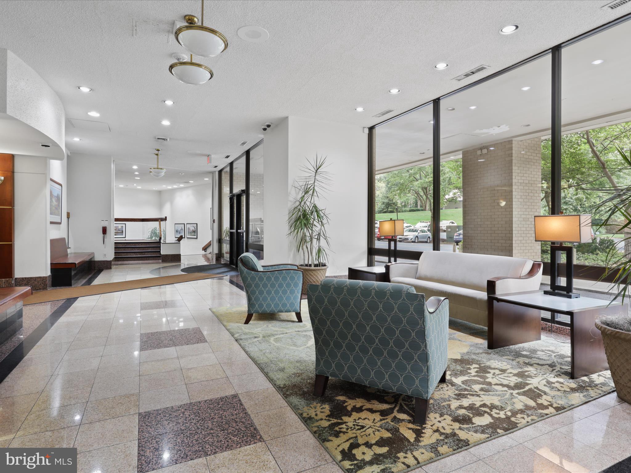 205 Yoakum Parkway, Unit 1020 Alexandria, VA 22304 - Photo 30 of 62 a living room with furniture and a large window