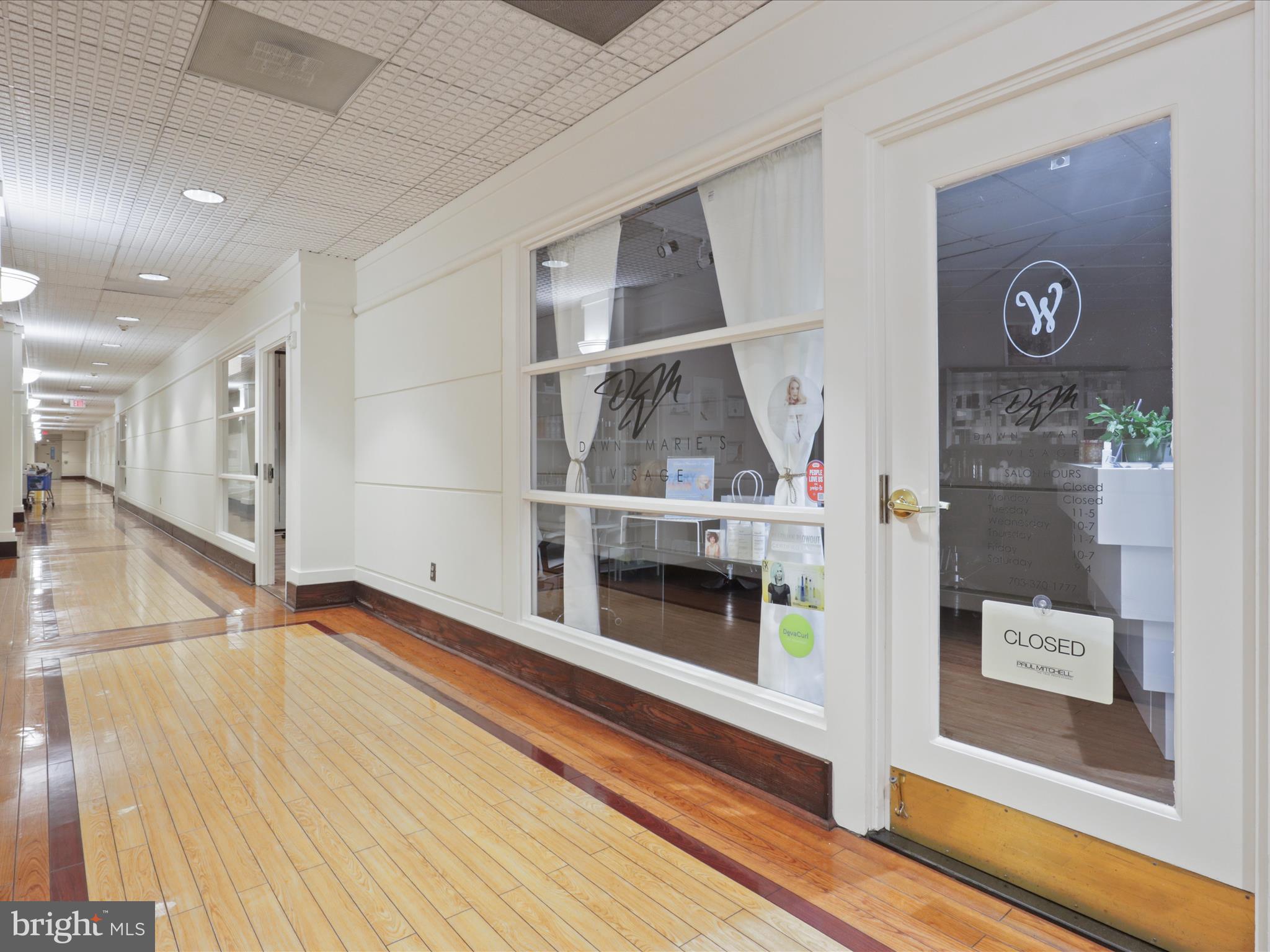 205 Yoakum Parkway, Unit 1020 Alexandria, VA 22304 - Photo 33 of 62 a view of a hallway with wooden floor and staircase